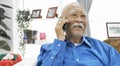 Asian Senior man with white mustache talking with smart phone Royalty Free Stock Photo