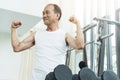 Asian senior man working out at the gym. Royalty Free Stock Photo