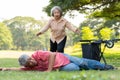 Asian senior man falling down from wheelchair on lying floor after trying push the wheelchair forward and Crying in pain and Royalty Free Stock Photo