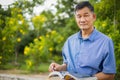 Asian men relax at home. Asian Senior men read books at home - lifestyle senior concept