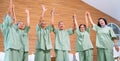 Asian senior men and women raise their hands up and express of happiness together with concept of good health and cheerful for Royalty Free Stock Photo