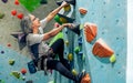 Asian senior old healthy sportive man climbing rock mountain for adventure, sport. Activity and Retirement Concept Royalty Free Stock Photo