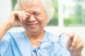 Asian senior old woman patient feel sad and cry when pain from sick for lonely depression in hospital Royalty Free Stock Photo