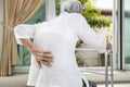 Asian senior patient with lower back pain or back muscle injury,old elderly having backache,painful of spinal joint,inflammation Royalty Free Stock Photo