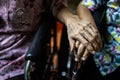 Asian senior people and old friends in wheelchair,holding hands to encourage each other in times of discouragement and despair, Royalty Free Stock Photo