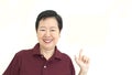 Asian senior pointing smiling on white isolate background