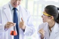 Asian senior scientist have teaching young student scientist in a laboratory Royalty Free Stock Photo