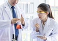 Asian senior scientist have teaching young student scientist in a laboratory Royalty Free Stock Photo