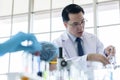 Asian senior scientist researching and learning in a laboratory Royalty Free Stock Photo