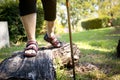 Asian senior woman balancing on wooden stump,healthy elderly people legs walking on the log timber at park,old people cross log Royalty Free Stock Photo