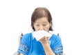 Asian senior woman blowing her nose Royalty Free Stock Photo