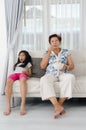 Asian senior woman eating popcorn Royalty Free Stock Photo