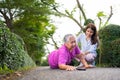 Asian senior woman fell down on lying floor because faint and limb weakness and Crying in pain form accident and her daughter came Royalty Free Stock Photo