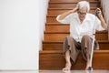 Asian senior woman have a severe headache,disease of brain tumor or brain cancer,pain in her head,sick old elderly sits on the Royalty Free Stock Photo