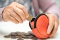 Asian senior woman holding counting coin money in purse. Poverty, saving problem in retirement Royalty Free Stock Photo