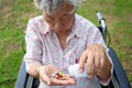 Asian senior woman medicine pills or capsules in hand,sick female patient taking,eating vitamin,antibiotic,painkiller,nutritional Royalty Free Stock Photo