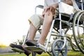 Asian senior woman sit in wheelchair because leg knee pain and hands to holding her knee,elderly with acute knee joint pain,bone Royalty Free Stock Photo