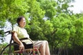 Asian senior woman sitting on a wheelchair