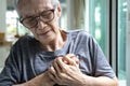 Asian senior woman touching her chest,heart attack,female elderly clutching chest pain,angina pectoris disease,old people Royalty Free Stock Photo