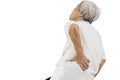 Asian senior woman touching the hip with her hand,waist hurts and lumbago pain,lumbar spine problems,old elderly suffering from