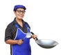 Asian senior woman, wears blue apron and cap, holds frying pan and spatula or ladle. Royalty Free Stock Photo