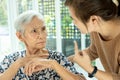 Asian senior woman is confused because she can not remember the face of their family or forget her daughter,memory loss in elderly Royalty Free Stock Photo