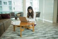 An Asian business woman using a laptop in library Royalty Free Stock Photo