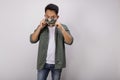 An Asian short hair man wears camouflage mask