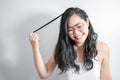 Asian Shy girl happy and smile with playing her hair in studio light white background Royalty Free Stock Photo