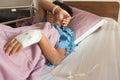 Asian sick boy on the bed in hospital
