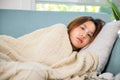 woman cold high fever covered with blanket resting sleeping at home Royalty Free Stock Photo