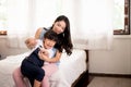 Asian single mom be easily incited and carrying her cheerful daughter at home,Happy and funny