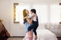 Asian single mom carrying her cheerful daughter at home,Happy and funny