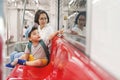 Asian mother and son traveling by commuter train Royalty Free Stock Photo