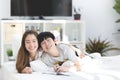 Asian sister and brother relaxing and playing on ther bed. Royalty Free Stock Photo