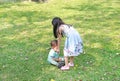 Asian sister take care her little brother in the garden outdoor Royalty Free Stock Photo