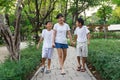 Asian sister and twin brother walking.