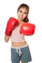 Asian slim girl punch with red boxing glove Royalty Free Stock Photo