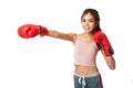 Asian slim girl punch with red boxing glove Royalty Free Stock Photo