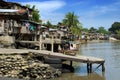 Asian slums on river bank Royalty Free Stock Photo