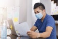 Asian small business start up working at Private Home Office social distancing among Coronavirus outbreak. Businessman wear face Royalty Free Stock Photo