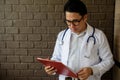 Asian smart doctor read patient record