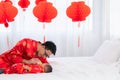 Asian smart young father feed his adorable son baby in bed  healthy fatherhood happy play with infant while feeding both father Royalty Free Stock Photo