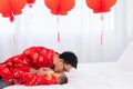 Asian smart young father feed his adorable son baby in bed  healthy fatherhood happy play with infant while feeding both father Royalty Free Stock Photo