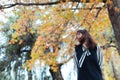 Asian female in autumn nature with black dressing Royalty Free Stock Photo