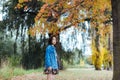 Asian female in autumn nature with jeans jacket Royalty Free Stock Photo