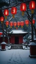 Asian snow covered garden with temple illuminated by the soft glow of red lanterns Royalty Free Stock Photo