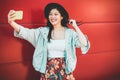 Asian social influencer woman making story for social network with smartphone camer- Happy girl having fun with new trends