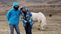 Asian son and mother taking family trip to Iceland. Taking photo