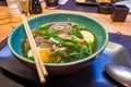 Asian soup with beef, noodles and egg, similar to pho bo or ramen Royalty Free Stock Photo